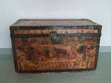 A decoupage covered military trunk circa 1830